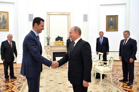 Why did Assad visit Putin ?