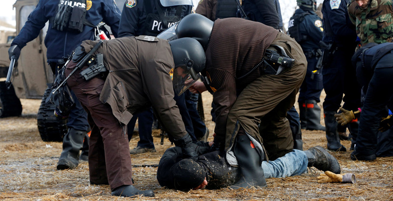 Police & military clear DAPL protest camp, dozens arrested, protesters start fires (Photo & Video)