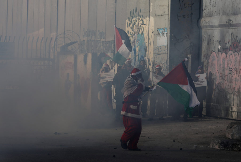 In Photos: Israeli Forces Clash With Palestinian Santa Clauses On Christmas Eve