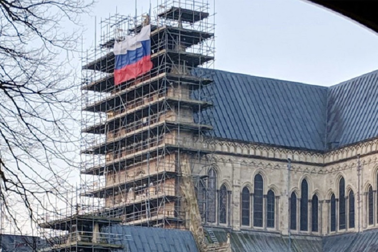 Propaganda War: Russian Flag Flies On Scaffolding At Salisbury Cathedral. Facebook Bans RT's In The NOW