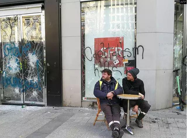 The Day After: Paris Burns As Macron Returns From Mountain Vacation