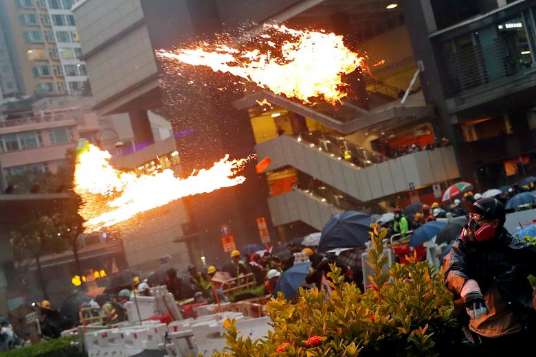 Police Officer Fires Live Round Into Air As Water Cannons Used In Potential Escalation Of Violence In HK