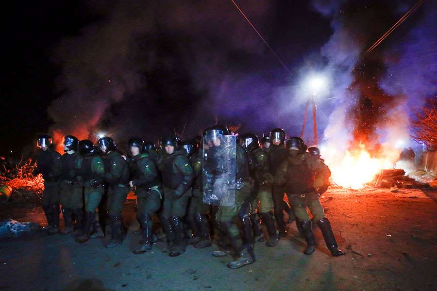 Ukrainians Evacuated From China Greeted Warmly With Riots