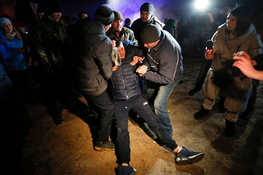 Ukrainians Evacuated From China Greeted Warmly With Riots