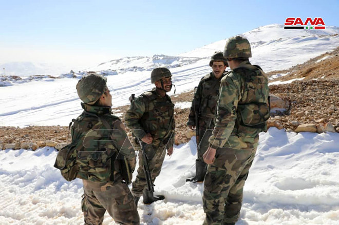 Syrian Soldiers Climb Mount Hermon (Photos)