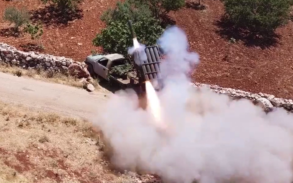 In Video: Hay’at Tahrir Al-Sham Shelling Government-Held Towns In Greater Idlib With Improvised Rockets, Artillery